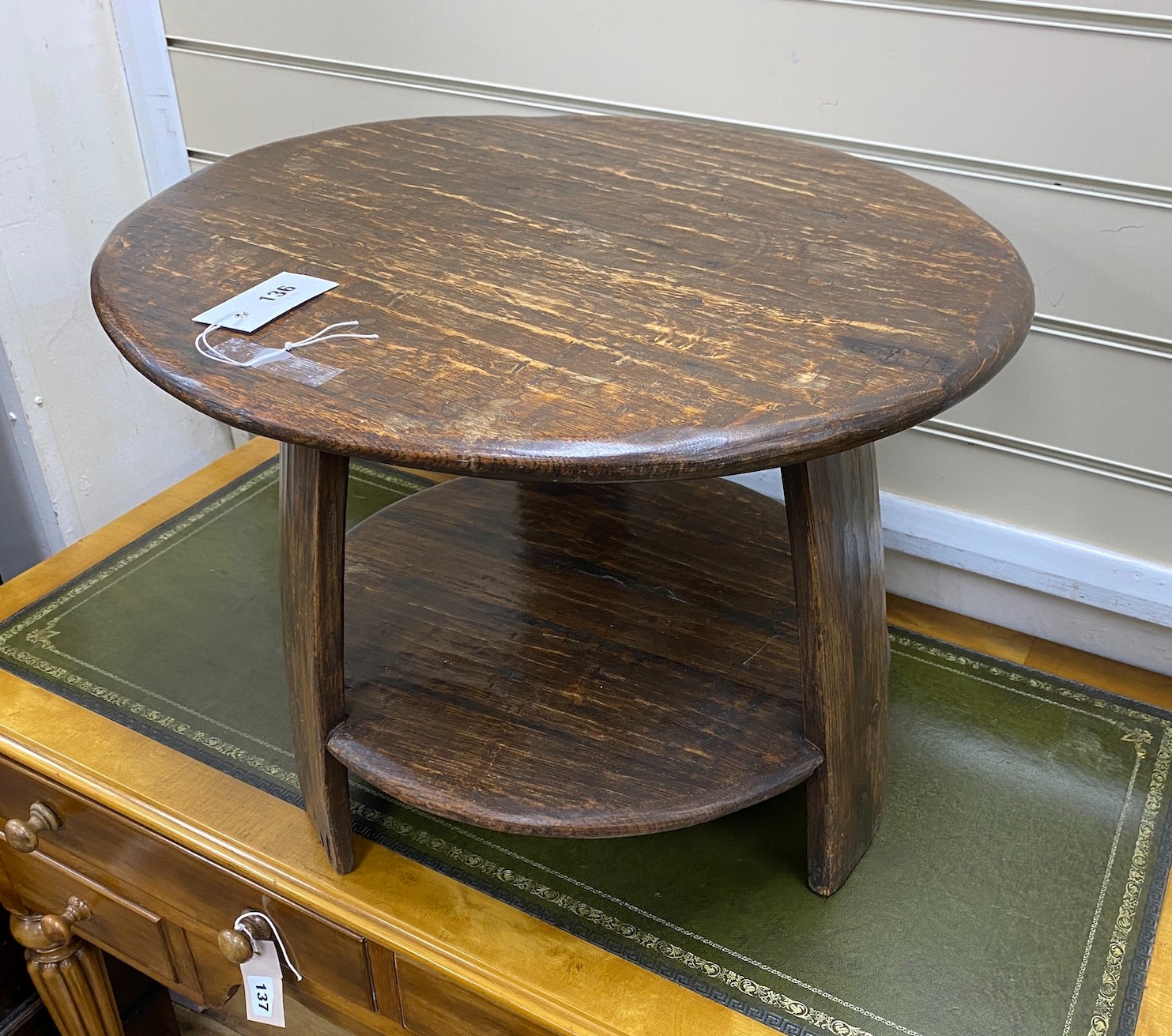 A provincial circular oak two-tier table, diameter 53cm, height 40cm